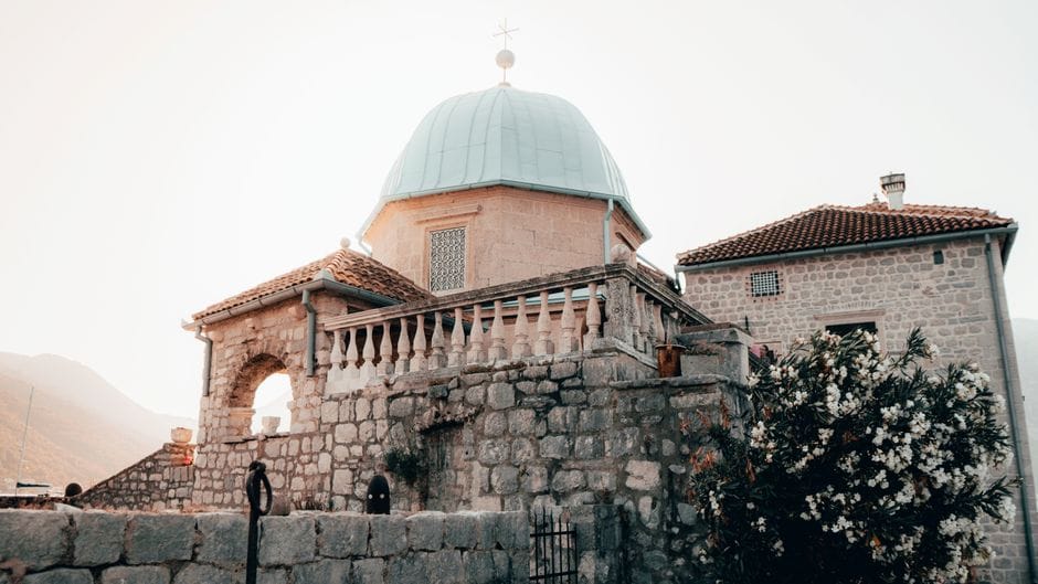 Explore the historic Our Lady of the Rocks Church, a captivating landmark in Montenegro's scenic Bay of Kotor.
