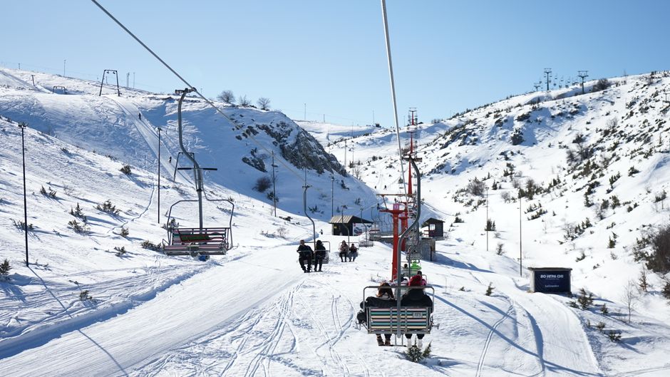 Snow-covered mountains with a ski lift in Mavrovo, North Macedonia. Perfect winter adventure.