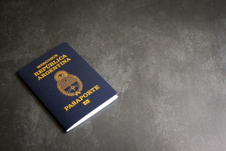 High-quality image of an Argentinian passport on a dark slate background, ideal for travel themes.