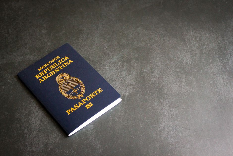 High-quality image of an Argentinian passport on a dark slate background, ideal for travel themes.