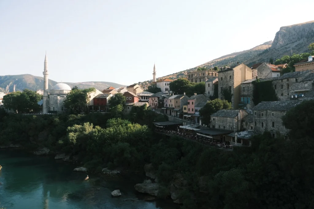 Historic town with minarets and river below