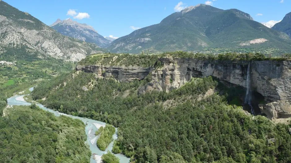 Panoramic landscape of Mont-Dauphin, Provence, featuring lush greenery and mountains.